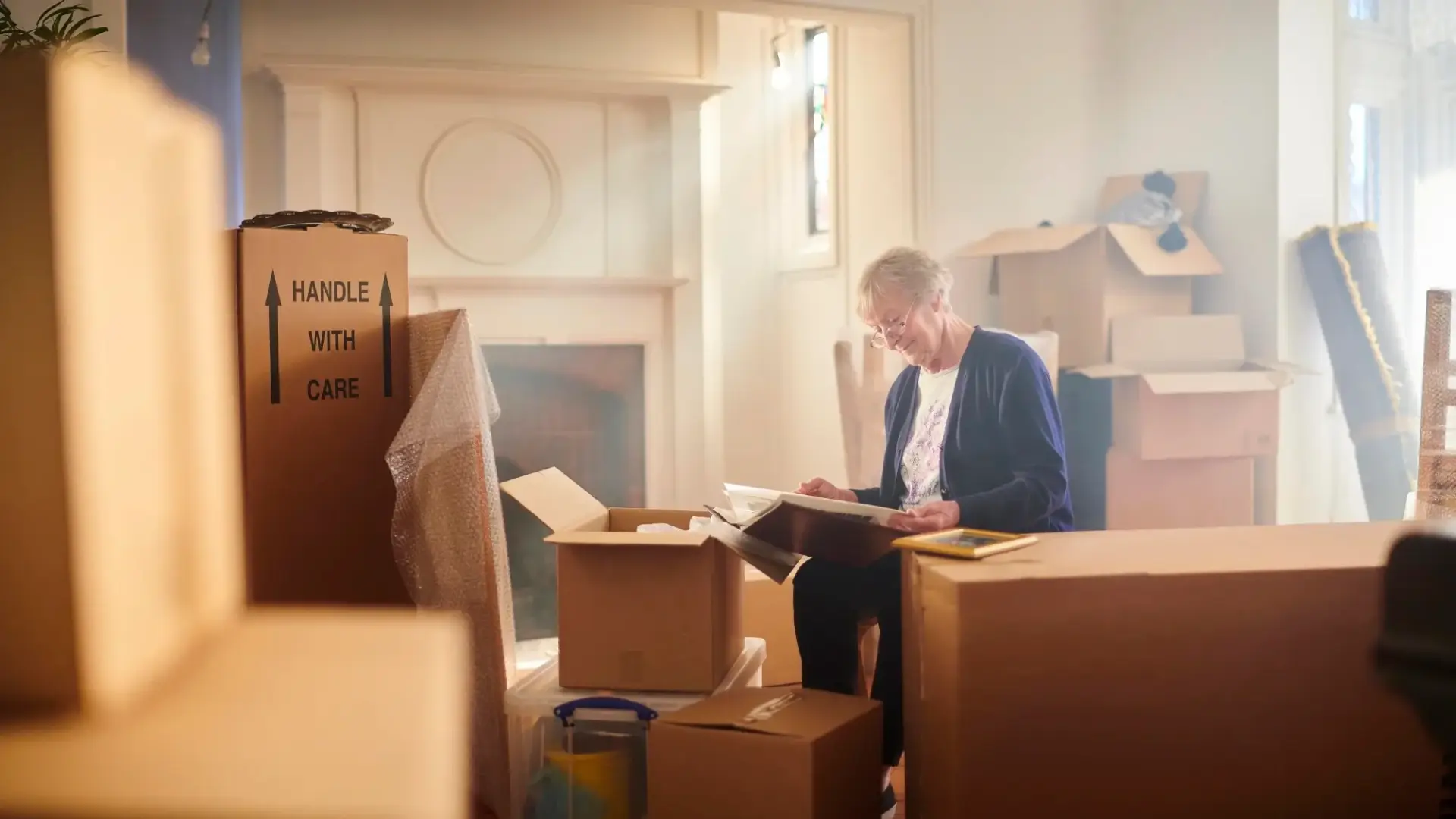 How to talk to your parents about downsizing and a senior packing her home.